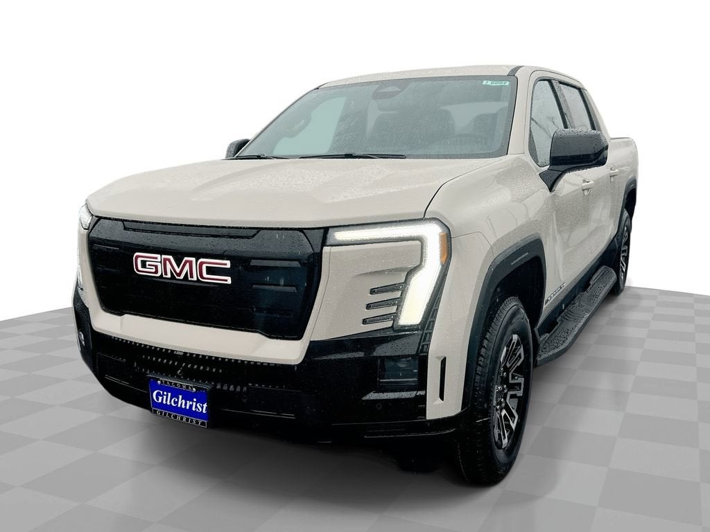 2026 GMC Sierra EV Elevation Standard Range in Coastal Dune — front three-quarter view