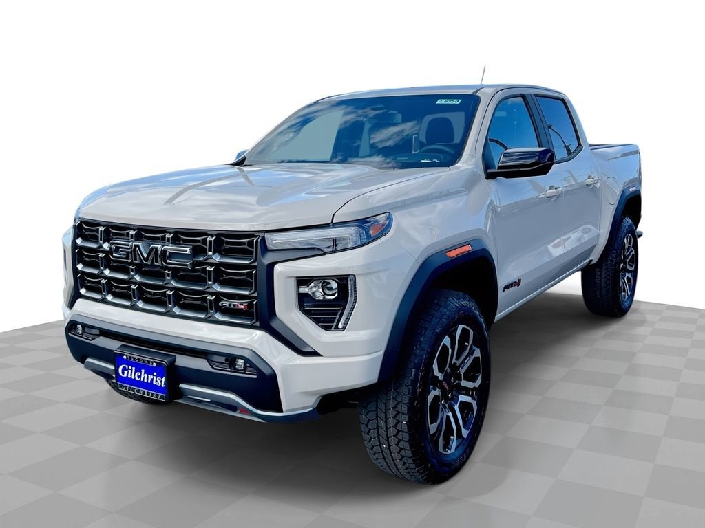 2026 GMC Canyon AT4 in Coastal Dune — front three-quarter view
